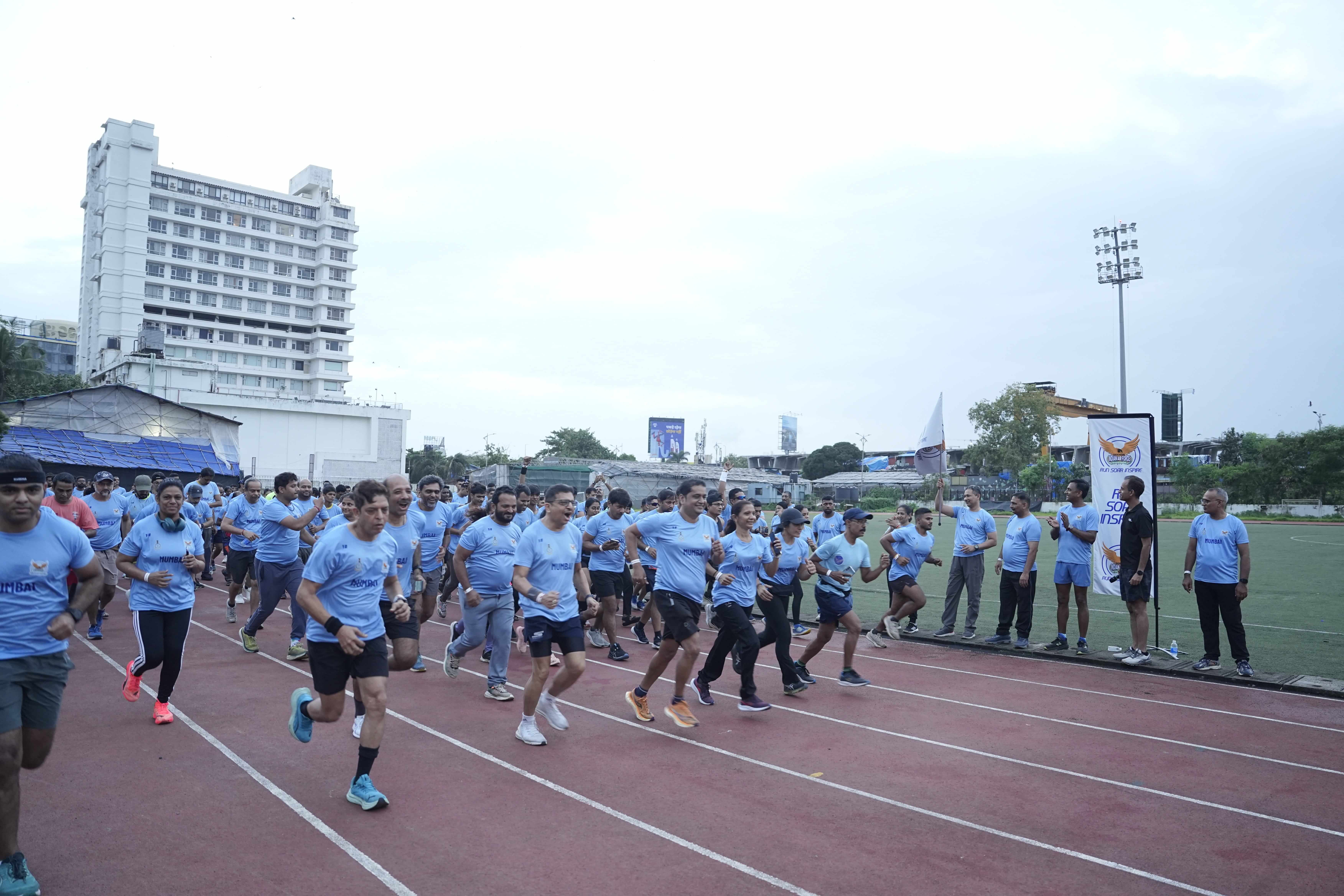 Flag-off start with runners charging down the track